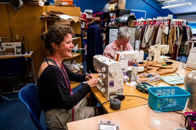 Staff and volunters preparing costumes at the York Theatre Royal Wardrobe Department in York  for the new tudor production Sovereign. Pictured Chloe Moore, Senior Wardrobe Technician, working alongside volunteer Catherine Sotheran.