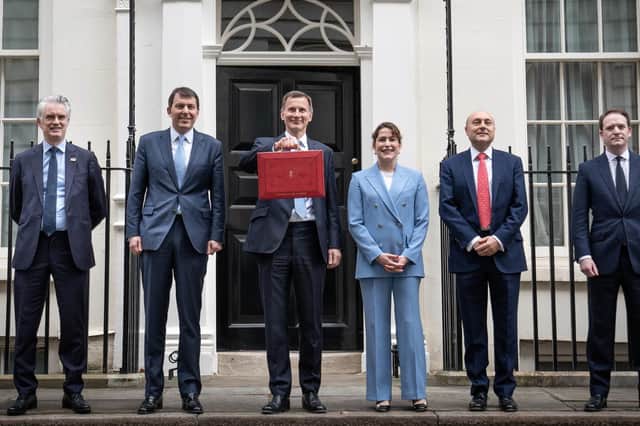 t Chancellor of the Exchequer Jeremy Hunt leaves 11 Downing Street, London, with his ministerial box and members of his ministerial team