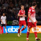 Barnsley's Sam Cosgrove (centre) celebrates scoring their side's third goal of the game during the Sky Bet League One play-off, semi-final, second leg match at Bolton. Picture: Martin Rickett/PA Wire.
