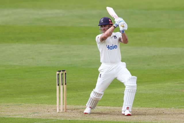 Warwickshire's Sam Hain cuts the ball away. Photo by Dan Istitene/Getty Images.