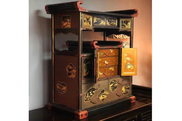 A large Japanese Meiji Period table cabinet with superb quality lacquer panels decorated all sides, c1880.