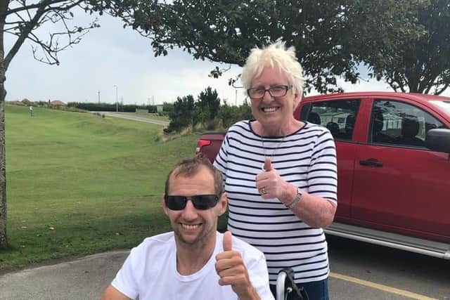 Thumbs up from Rob and his devoted mum Irene Burrow on a day out in 2021