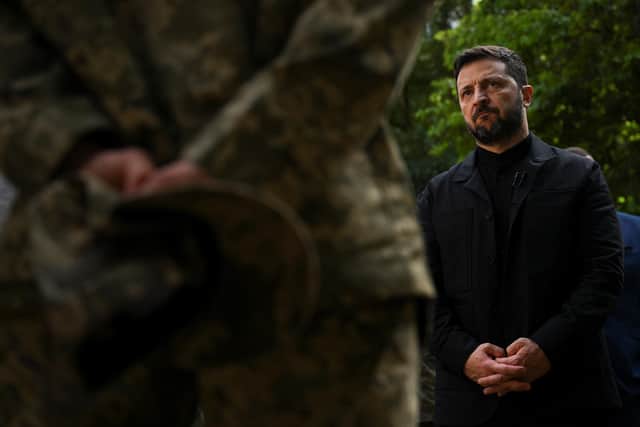 Ukrainian President Volodymyr Zelensky speaks to a soldier. PIC: Jaimi Joy/PA Wire