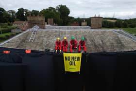 Greenpeace activists on the roof of Prime Minister Rishi Sunak's house in Richmond, North Yorkshire. (Credit: PA)
