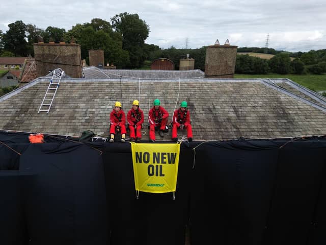 Greenpeace activists on the roof of Prime Minister Rishi Sunak's house in Richmond, North Yorkshire. (Credit: PA)