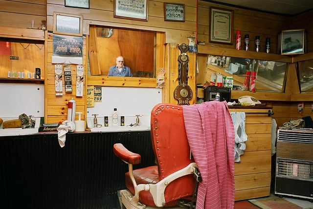 Tommy's Barber Shop - with Tommy in the mirror.