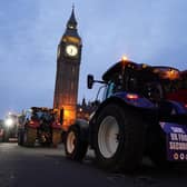 Farmers take part in a tractor "go-slow" through Parliament Square, Westminster, to raise awareness of the difficulties for the British farming industry which are putting food security at risk. PIC: Jordan Pettitt/PA Wire