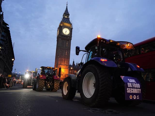 Farmers take part in a tractor "go-slow" through Parliament Square, Westminster, to raise awareness of the difficulties for the British farming industry which are putting food security at risk. PIC: Jordan Pettitt/PA Wire