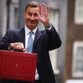 Chancellor Jeremy Hunt leaves Downing Street to present his spring budget to Parliament.