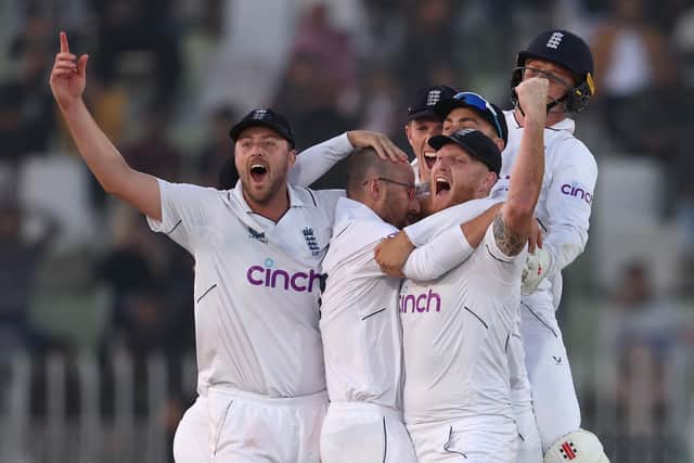 The game is about the glory. England celebrate confirmation on the big screen of Jack Leach's match-clinching wicket in the Rawalpindi Test. Photo by Matthew Lewis/Getty Images.