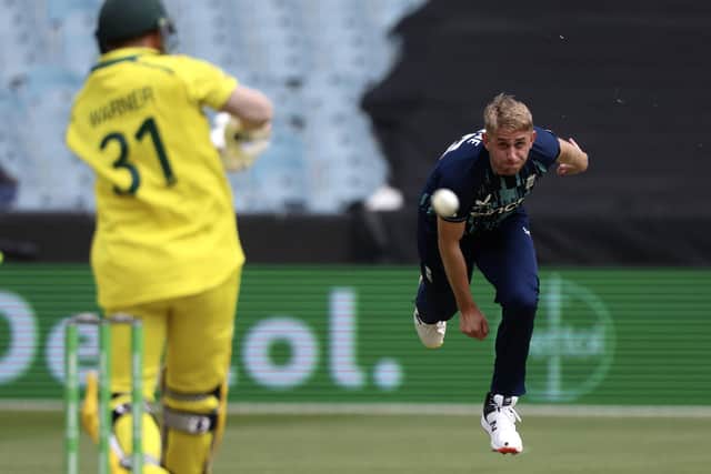 TOUGH GOING: England's Olly Stone, right, bowls to Australia's David Warner during the third and final ODI in Melbourne Picture: AP/Asanka Brendon Ratnayake