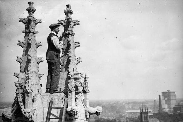 A workman is pictured renovating the Gothic spires of St Peter’s cathedral in York Minster on August 13, 1931.