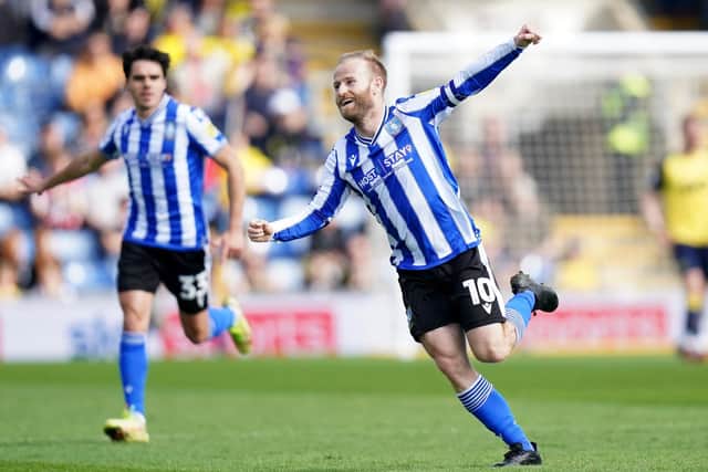 OPENING STRIKE: Sheffield Wednesday’s Barry Bannan (right) celebrates scoring the opening goal against hosts Oxford United at the Kassam Stadium Picture: Adam Davy/PA
