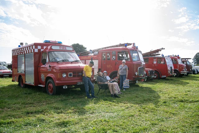 Exhibitors meet up by the vintage fire tenders at Hunton Steam Gathering near Bedale.