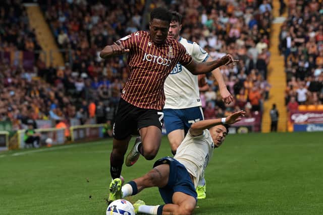 Bradford City's Josh Neufville is brought down by Huddersfield Town's Ruben Roosken. Picture: Jonathan Gawthorpe