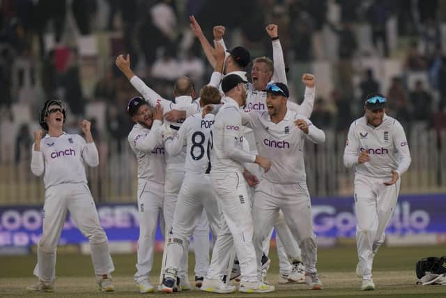 GAMBLE: England's players celebrate after winning the first Test match against Pakistan in Rawalpindi by 74 runs on the fifth and final day Picture: AP Photo/Anjum Naveed.