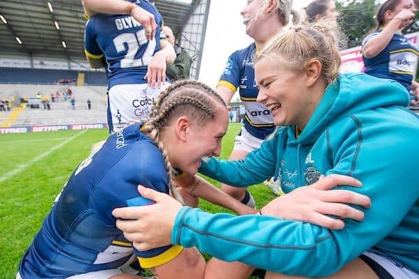 Beth Lockwood, right, congratulates Caitlin Beevers after Rhinos' semi-final win over Wigan. (Picture by Allan McKenzie/SWpix.com)