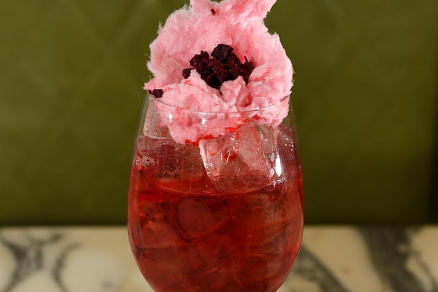 The Sakura Blossom Spritz contains Roku Gin with cherry blossom, ume plum, yuzu and white tea soda topped with pink candy floss. Try not to get any up your nose.