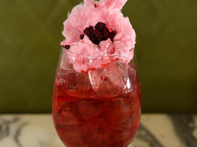 The Sakura Blossom Spritz contains Roku Gin with cherry blossom, ume plum, yuzu and white tea soda topped with pink candy floss. Try not to get any up your nose.