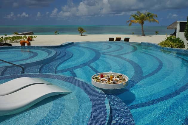 Food is served in the glass pool at the Kanifushi Residence