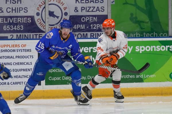 GOING THROUGH: Brett Neumann (right) - a goalscorer for Sheffield Steelers in Kirkcaldy - battles with Fife Flyers' Colin Shirley during the second leg of their Elite League play-off quarter0-final tie, the Steelers eventually progressing to the final four 13-5 on aggregate. Picture: Jill McFarlane/EIHL Media.