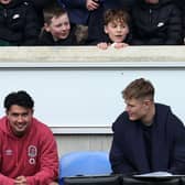 We're watching you: Marcus Smith (L) and Fin Smith sit out training on the bench as young fans watch on during the England training session held at the LNER Community Stadium on March 01, 2024 in York, England. (Picture:  David Rogers/Getty Images)