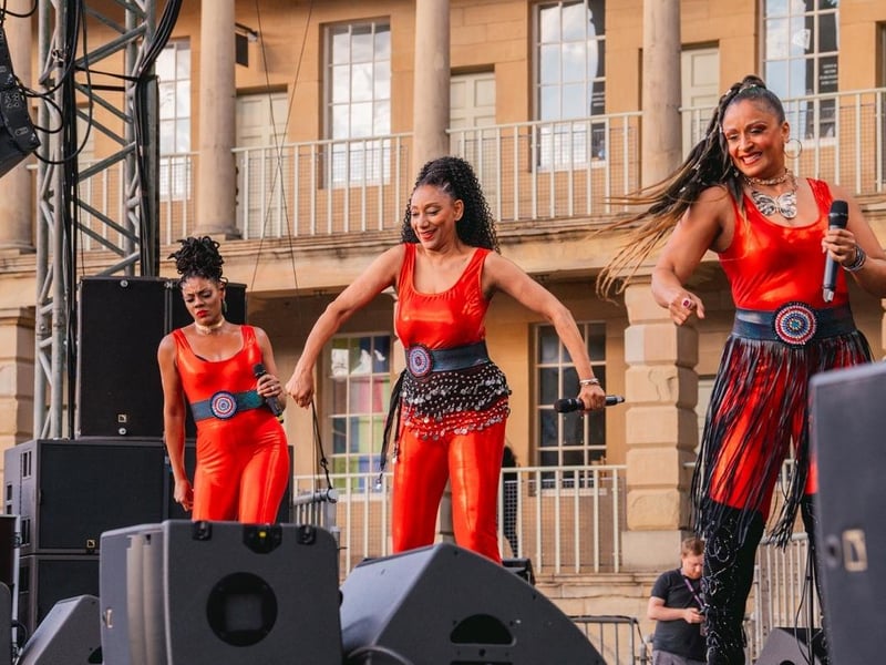 Sister Sledge performing on stage.
