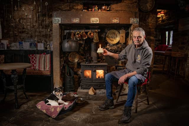 Ed Yarrow landlord at The George Inn Hubberholme keeping the tradition of  nearly 400 years of keeping a candle lit when the premises are open photographed for The Yorkshire Post by Tony Johnson.
The candle is also used in the annual land-letting auction known as the Hubberholme Parliament and is held on the first Monday night of the year in a tradition dating back centuries