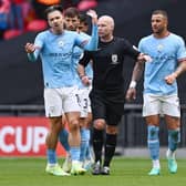 CONTROVERSY: Manchester City's Jack Grealish complains after referee Paul Tierney awards a penalty against him in the FA Cup final