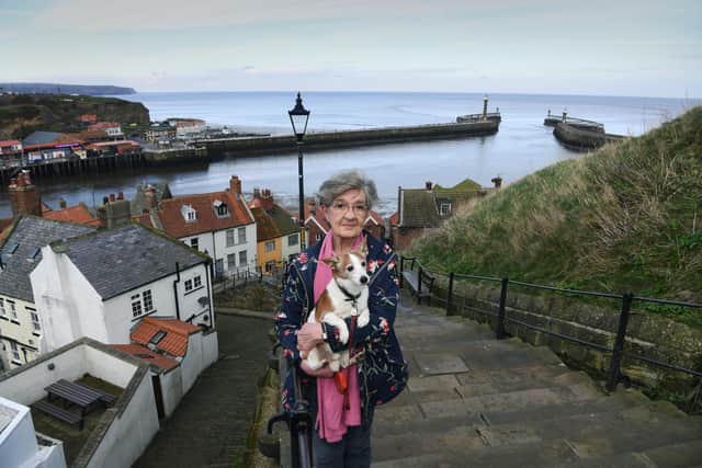 Whitby harbour.
Pictured Sue Boyce, with her dog Charlie.
13h February 2024.
Picture Jonathan Gawthorpe