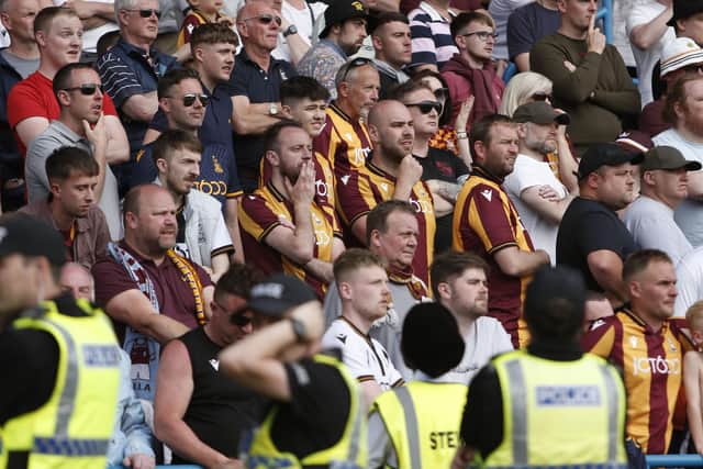 SO CLOSE: Bradford City fans watch on during the Sky Bet League Two play-off semi-final second leg match at Brunton Park. Picture: Will Matthews/PA