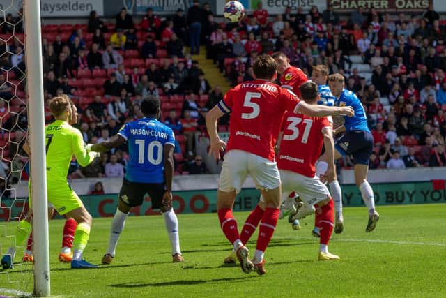 Glancing ahead: Jack Taylor, far right, heads the ball goalwards to beat Harry Isted, left, as Peterborough gatecrashed the top six with victory that leaves Barnsley with a few questions about momentum (Picture: Ian Hodgson/PA)