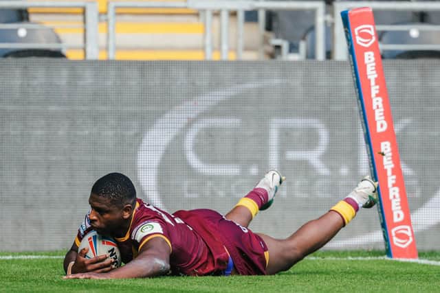 Jermaine McGillvary slides over for a try in last week's win at Hull. (Photo: Alex Whitehead/SWpix.com)
