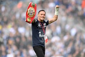 LEEDS, ENGLAND - APRIL 02: IBF world featherweight champion, Josh Warrington shows off their belt to the fans prior to the Premier League match between Leeds United and Southampton at Elland Road on April 02, 2022 in Leeds, England. (Photo by Stu Forster/Getty Images)