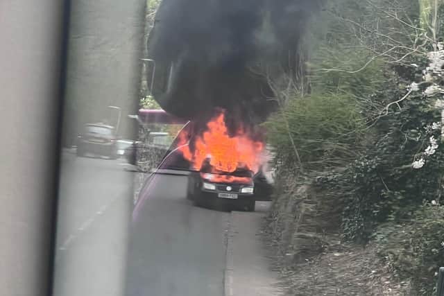 The car on fire before it hit the bus