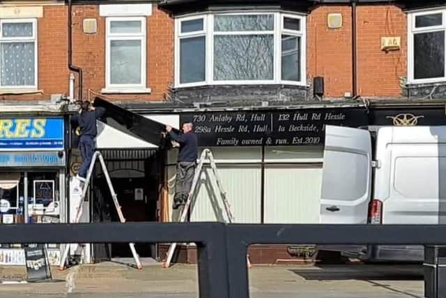 Workmen remove signage at scandal-hit Legacy Funeral Directors in Hull