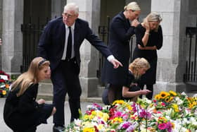 (Left-right) Princess Beatrice, the Duke of York, Zara Tindall, Lady Louise Windsor and the Countess of Wessex view the messages and floral tributes left by members of the public at Balmoral in Scotland following the death of Queen Elizabeth II on Thursday. Picture date: Saturday September 10, 2022.