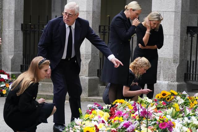 (Left-right) Princess Beatrice, the Duke of York, Zara Tindall, Lady Louise Windsor and the Countess of Wessex view the messages and floral tributes left by members of the public at Balmoral in Scotland following the death of Queen Elizabeth II on Thursday. Picture date: Saturday September 10, 2022.