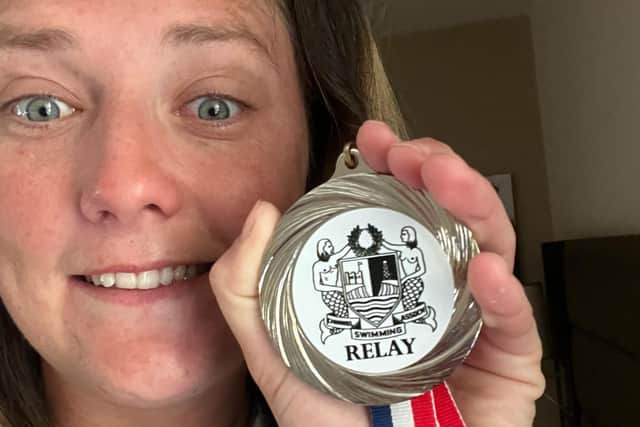 Jasmine Harrison with her Channel Relay medal