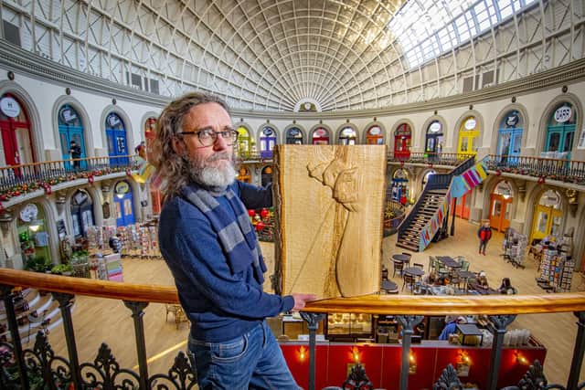 Jamie Frost with his work 'Sound of Music', a relief made in ash and brass on show at the Sculpture Gallery in the Corn Exchange in Leeds. Picture by Tony Johnson.