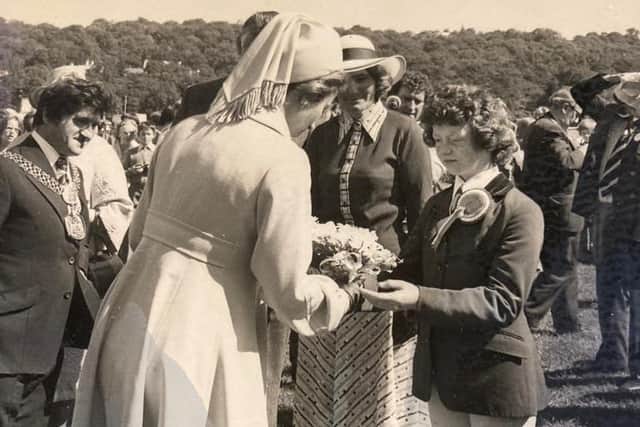 Young member Susan Tinkler presenting Princess Anne with a bouquet during her 1977 visit. To Susan’s right is Nora Halstead, one of the founders who sadly passed away this March.
