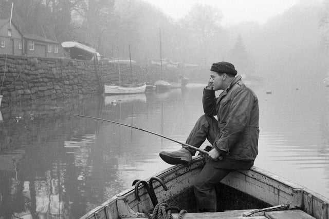 A lonely angler on the River Almond at Cramond in February 1962.