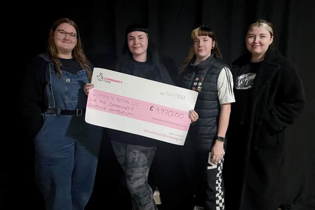 From left to right, actors Katie Greensmith, Lizzie Waterhouse, Abigail Waite, and Rachel Vincent celebrate after Empath Action received a grant from the National Lottery Community Fund for a new costume emporium in Wakefield.