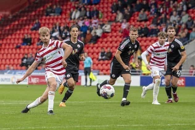 George Miller converts from the penalty spot for Doncaster Rovers in their recent win against Crawley. Picture: Tony Johnson.