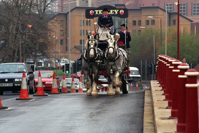 Archive pic from 1995 showing the Tetley dray horses 'Prince', left, and 'Charles' making their way over the newly widened Crown Point Bridge in Leeds