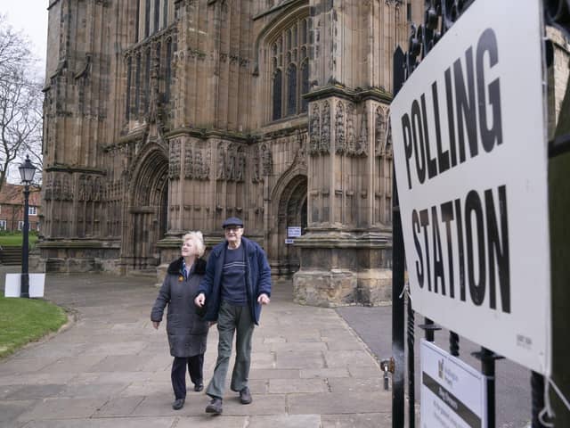 People leave after casting their vote at the polling station in Bridlington Priory Church, Yorkshire, in last year's elections. PIC: Danny Lawson/PA Wire