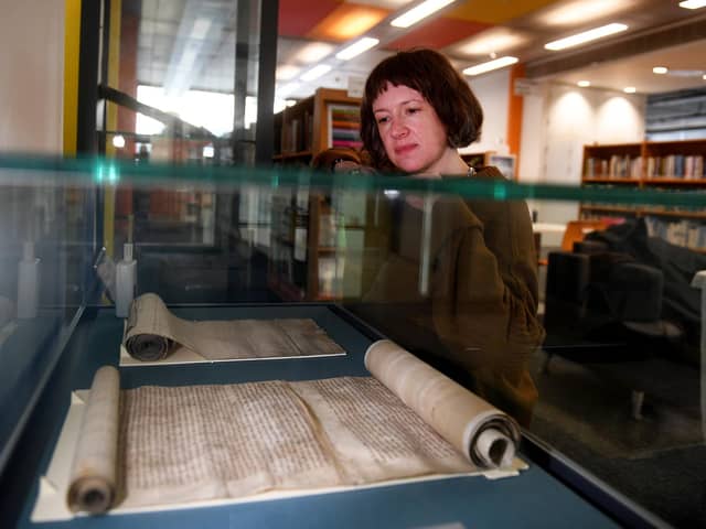 To mark the 725th anniversary, the exhibition '˜Hull/Ravenser Odd: twin cities, sunken pasts' will display the original Hull and Ravenser Odd charters, on loan from The National Archives. The exhibition will also highlight existing items in Hull History Centre's collection (Hull's 1299 charter, maps of medieval Hull), and bring the little-known story about the sinking of Ravenser Odd and the ascendancy of Hull to life. Dr Emily Robinson is pictured with the  charter roll from Edward I April 1st 1299..Picture taken by Yorkshire Post Photographer Simon Hulme 25th March 2024