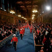 Yeomen of the Guard, wearing traditional uniform, walk through the Royal Gallery before the State Opening of Parliament in the House of Lords. PIC: Hannah McKay/PA Wire