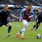 No way past: Huddersfield Town's Tom Lees, left, shadows Burnley's Johann Gudmundsson during Saturday's comfortable win for the Clarets (Picture: Will Matthews/PA)