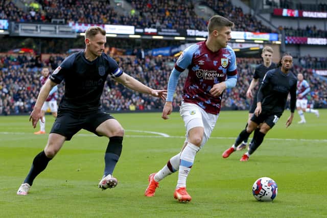 No way past: Huddersfield Town's Tom Lees, left, shadows Burnley's Johann Gudmundsson during Saturday's comfortable win for the Clarets (Picture: Will Matthews/PA)